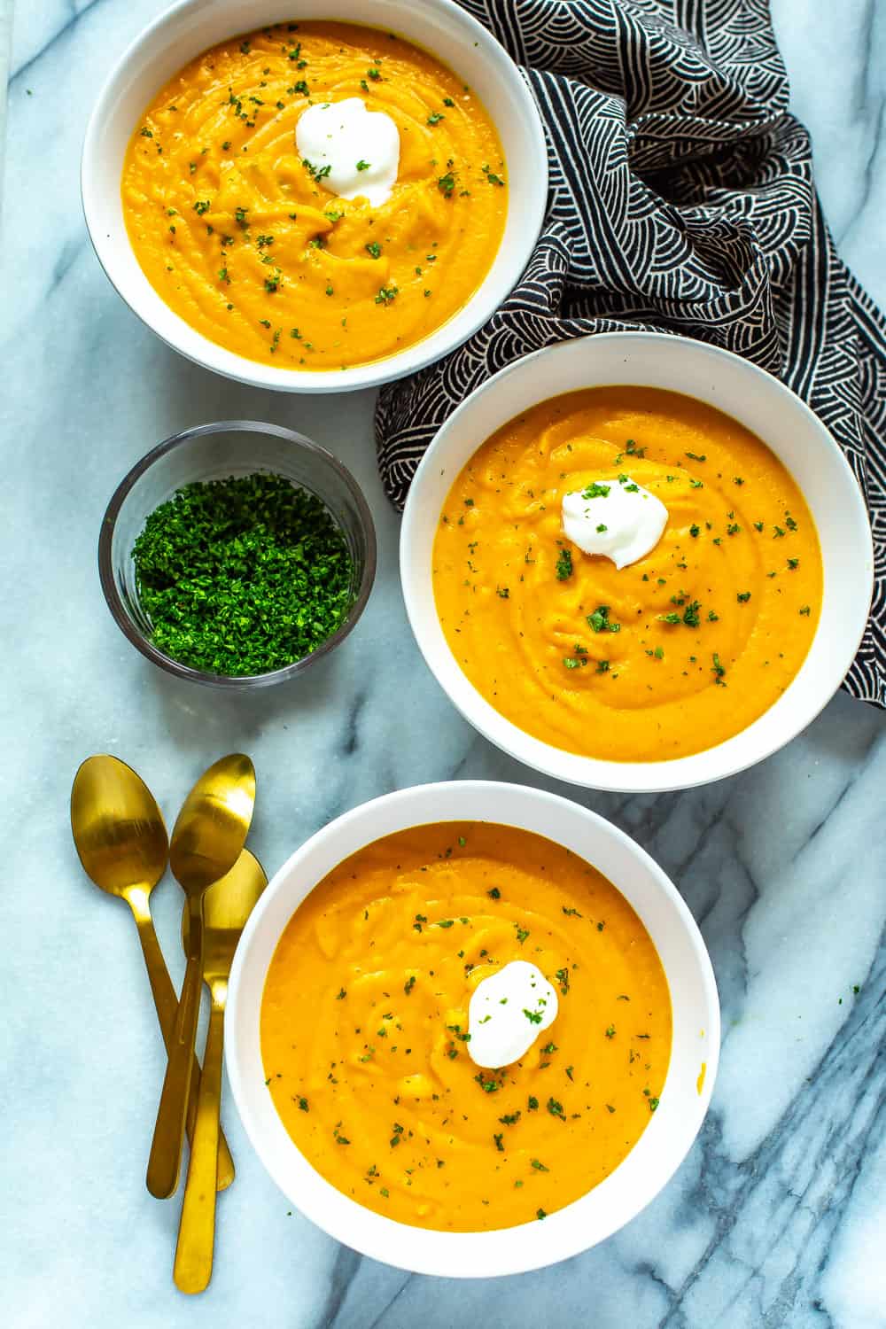 3 bowls of creamy coconut milk carrot soup