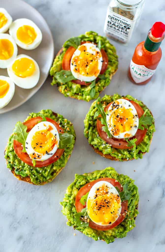Instant Pot soft boiled eggs on open-faced breakfast sandwiches.