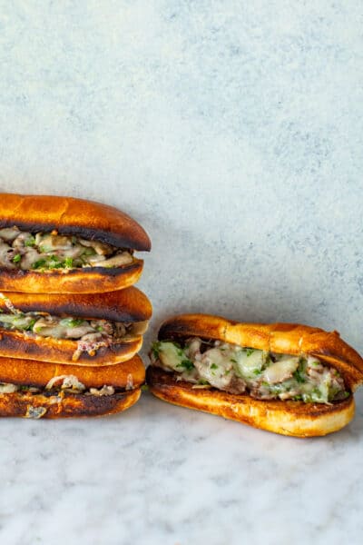 Four Instant Pot Philly Cheesesteak sandwiches.